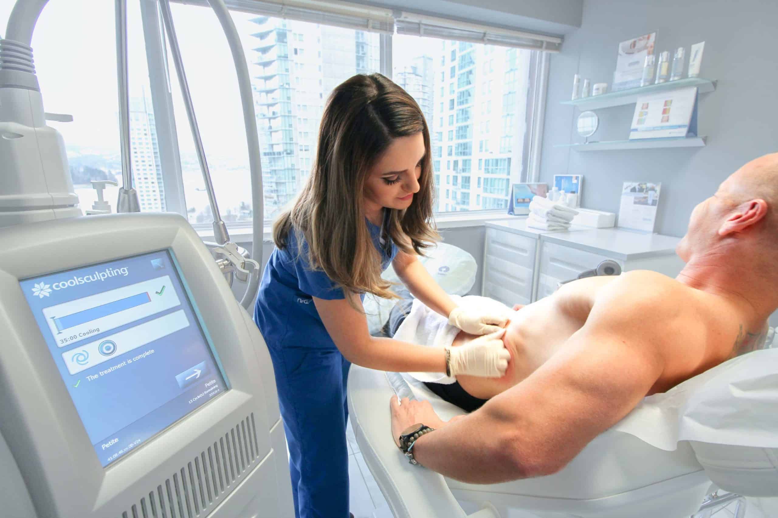 A consultant working with a patient before a coolsculpting treatment, discussing coolsculpting cost estimates